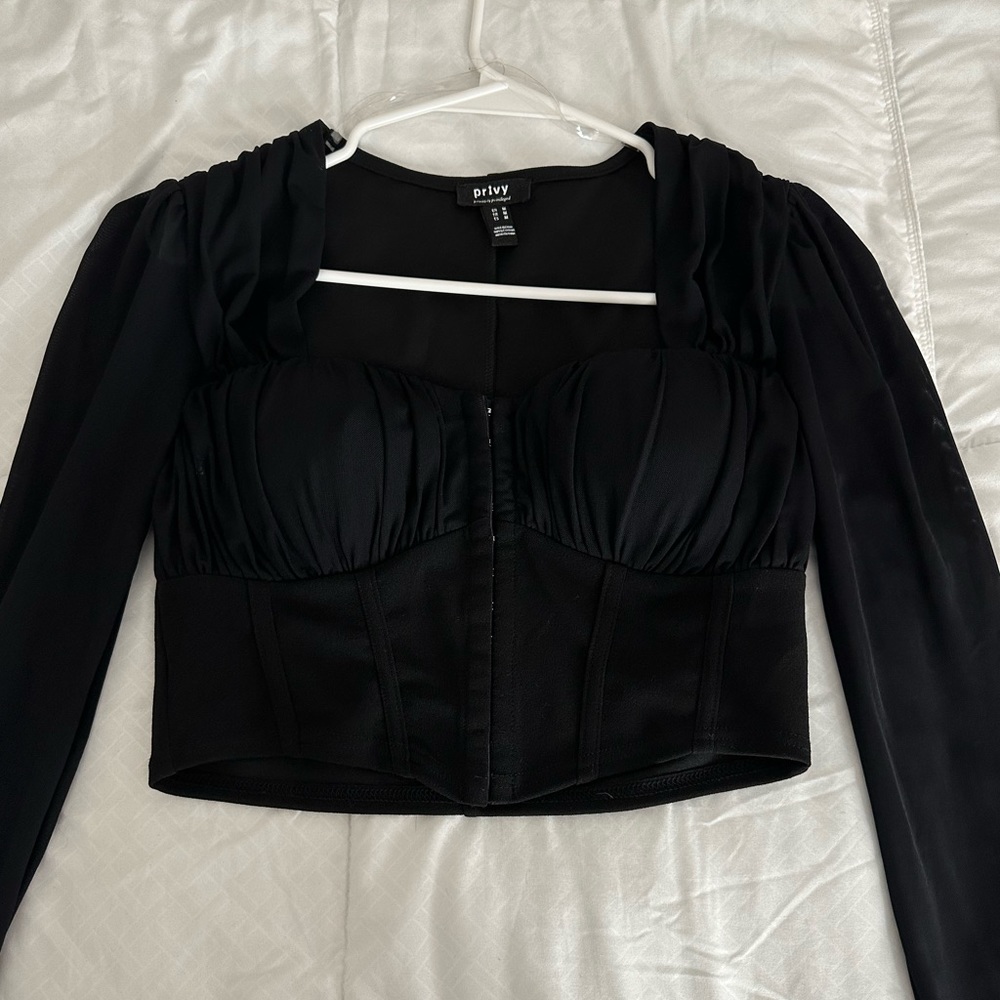 Black long sleeve top. Size Medium. Brand new with no tags (Never worn).